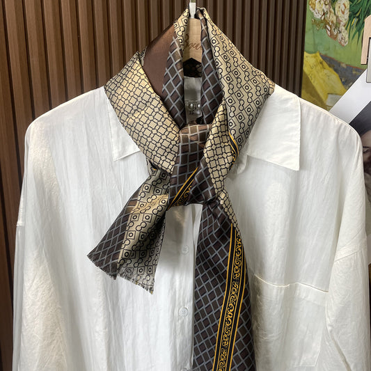 Expertly crafted from luxurious 100% silk, this champagne gold paisley scarf adds a touch of elegance to any man's wardrobe.  The intricate paisley pattern compliments a variety of outfits, making it a versatile accessory for any occasion.  Stay stylish and sophisticated with this must-have accessory.